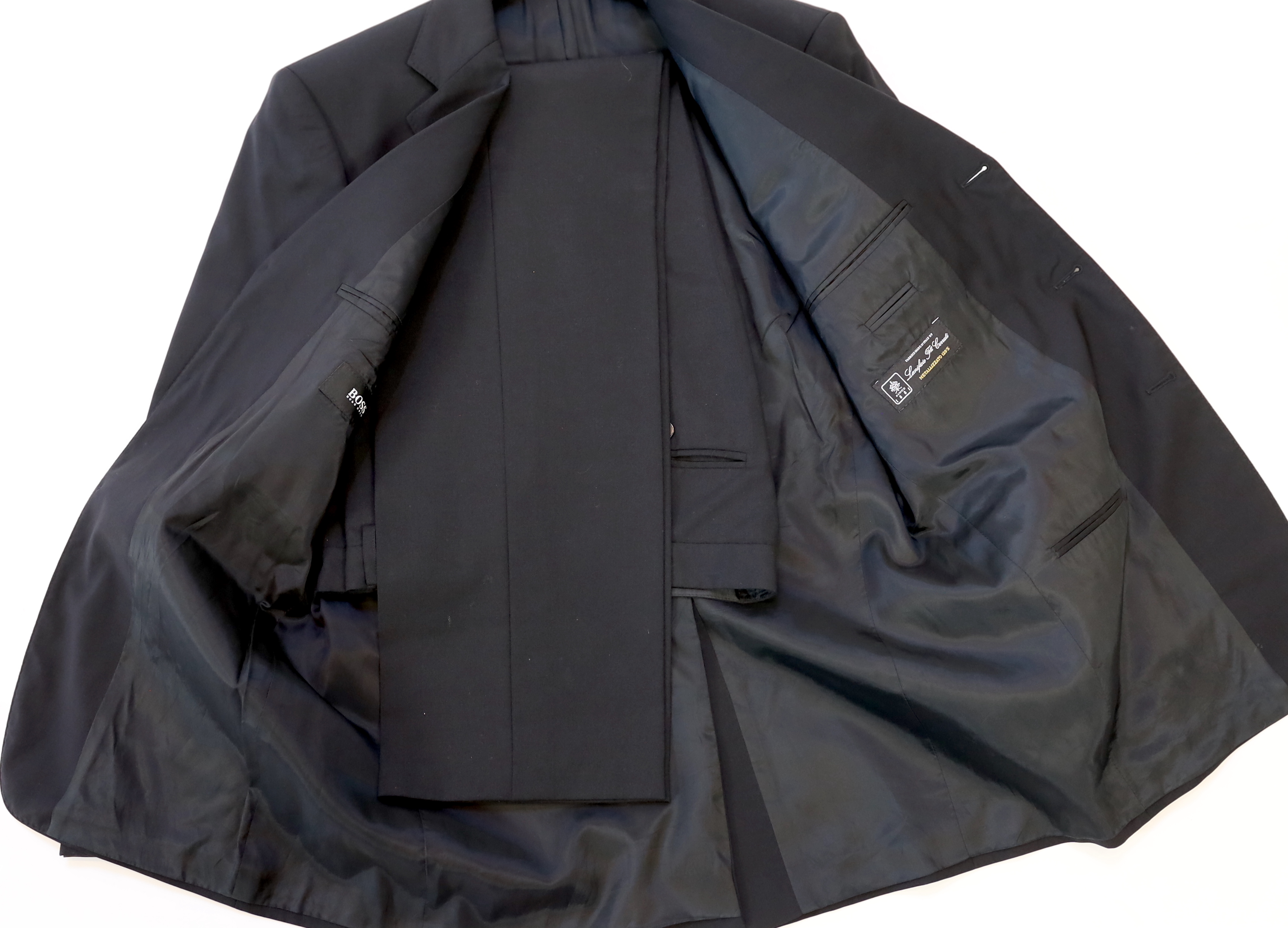 A Yves Saint Laurent, a Gucci and a Boss men's suits and Ralph Lauren and Emporio Armani jacket